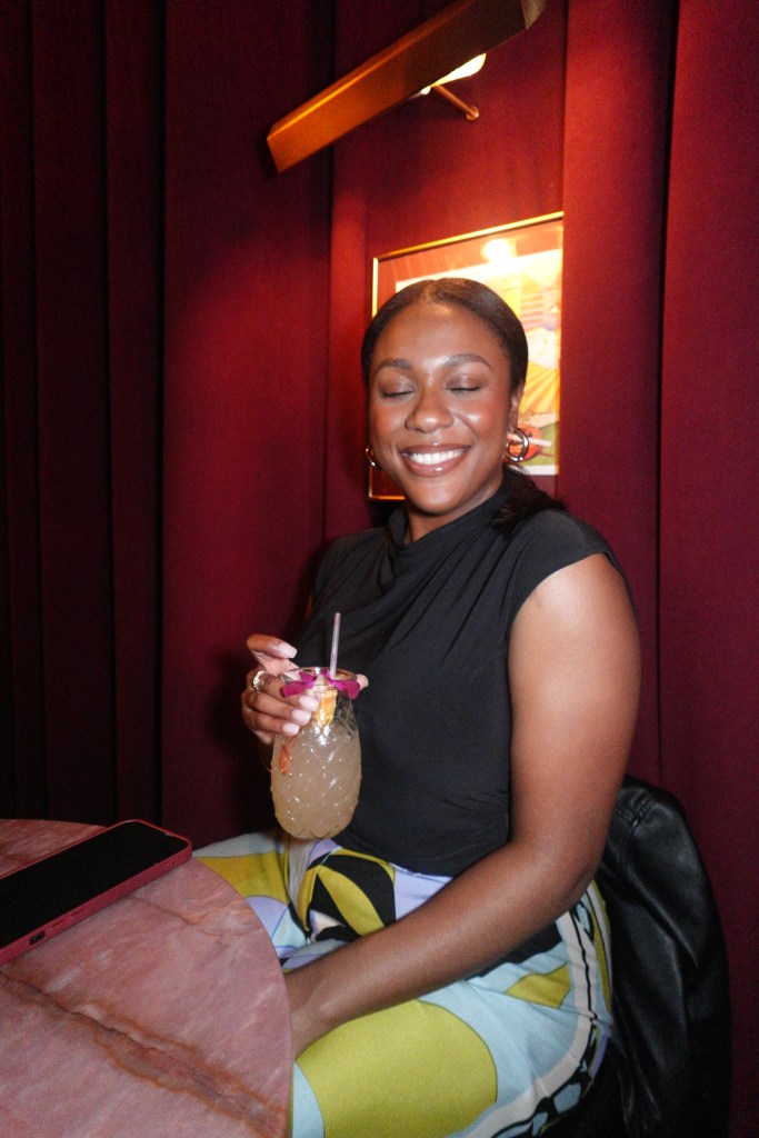 Friend enjoying a cocktail at JoJo's Beloved